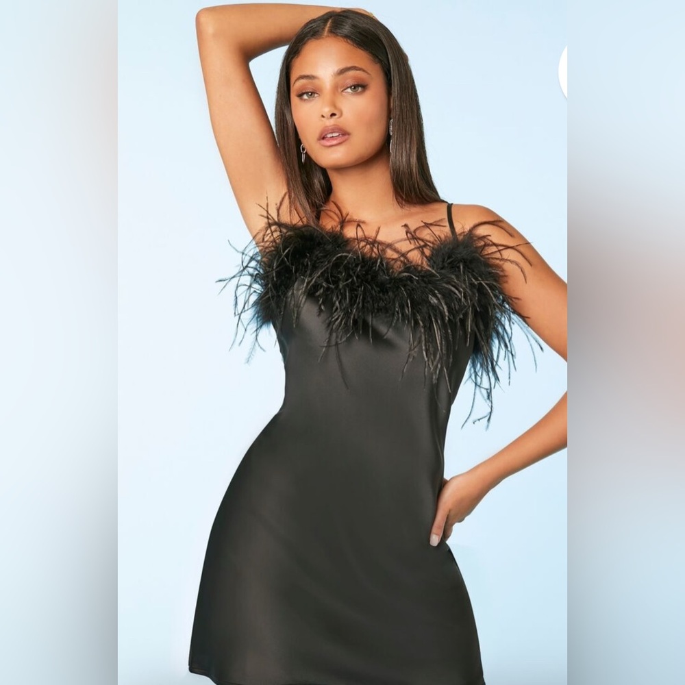 A satin slip dress featuring faux fur trim, a straight-cut neckline.